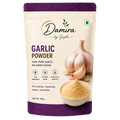 A 100g stand-up pouch of Damira by Gupta Garlic Powder, featuring a cream-colored background with purple accents, a graphic of a garlic bulb and clove, and a bowl of the yellowish powder.